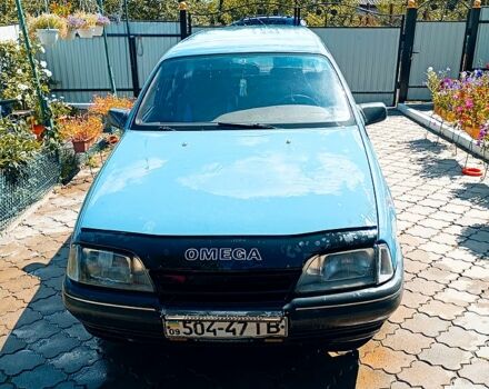 Синий Опель Омега, объемом двигателя 1.8 л и пробегом 210 тыс. км за 1400 $, фото 1 на Automoto.ua