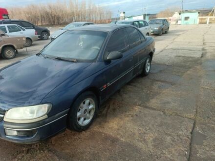 Синий Опель Омега, объемом двигателя 2 л и пробегом 440 тыс. км за 1300 $, фото 1 на Automoto.ua