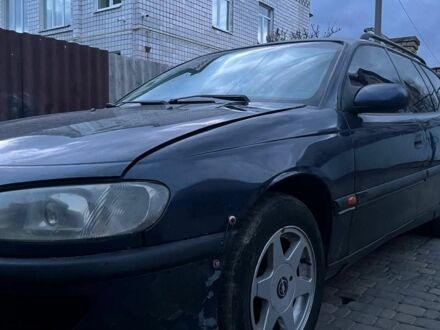 Синий Опель Омега, объемом двигателя 2.5 л и пробегом 200 тыс. км за 565 $, фото 1 на Automoto.ua