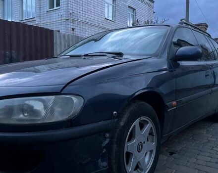 Синий Опель Омега, объемом двигателя 2.5 л и пробегом 200 тыс. км за 565 $, фото 1 на Automoto.ua