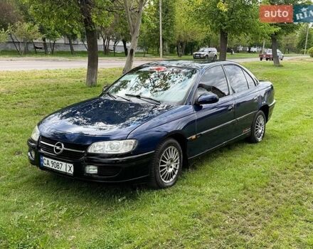 Синий Опель Омега, объемом двигателя 2.5 л и пробегом 250 тыс. км за 1550 $, фото 1 на Automoto.ua