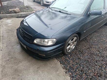 Синий Опель Омега, объемом двигателя 2.5 л и пробегом 250 тыс. км за 2200 $, фото 1 на Automoto.ua