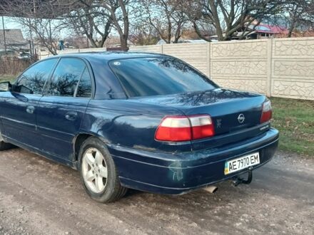 Синий Опель Омега, объемом двигателя 2.2 л и пробегом 230 тыс. км за 1450 $, фото 1 на Automoto.ua