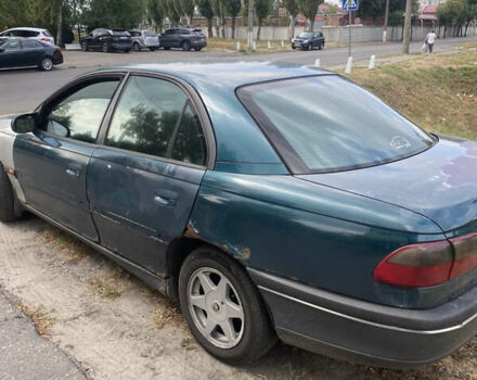 Зеленый Опель Омега, объемом двигателя 2 л и пробегом 400 тыс. км за 1250 $, фото 3 на Automoto.ua