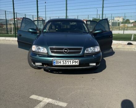 Зеленый Опель Омега, объемом двигателя 2.5 л и пробегом 300 тыс. км за 2500 $, фото 2 на Automoto.ua