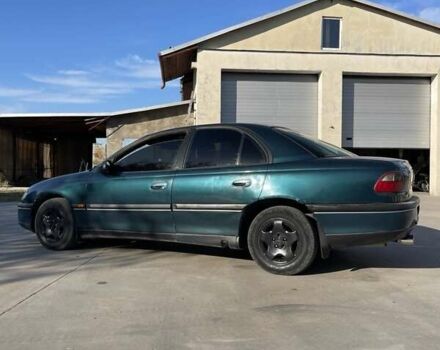 Зеленый Опель Омега, объемом двигателя 2 л и пробегом 300 тыс. км за 1800 $, фото 3 на Automoto.ua