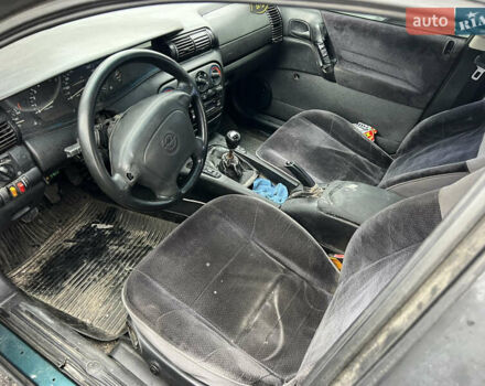 Зеленый Опель Омега, объемом двигателя 2 л и пробегом 350 тыс. км за 1500 $, фото 16 на Automoto.ua