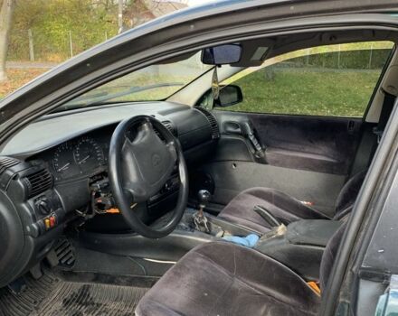 Зелений Опель Омега, об'ємом двигуна 2 л та пробігом 250 тис. км за 1300 $, фото 4 на Automoto.ua