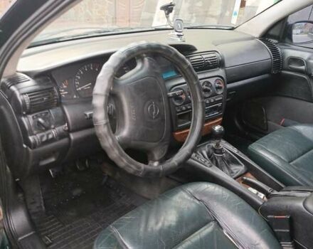 Зеленый Опель Омега, объемом двигателя 2.5 л и пробегом 400 тыс. км за 2150 $, фото 7 на Automoto.ua