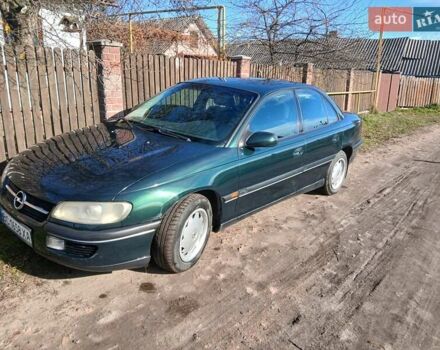Зелений Опель Омега, об'ємом двигуна 2 л та пробігом 397 тис. км за 1000 $, фото 12 на Automoto.ua