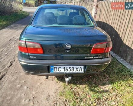 Зелений Опель Омега, об'ємом двигуна 2 л та пробігом 397 тис. км за 1000 $, фото 14 на Automoto.ua