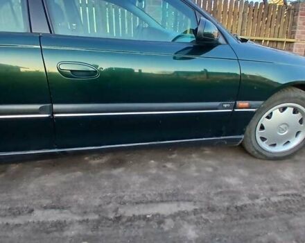 Зелений Опель Омега, об'ємом двигуна 2 л та пробігом 397 тис. км за 1000 $, фото 4 на Automoto.ua