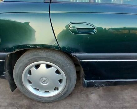 Зелений Опель Омега, об'ємом двигуна 2 л та пробігом 397 тис. км за 1000 $, фото 5 на Automoto.ua