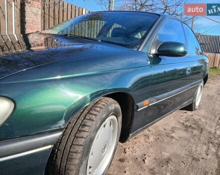 Зелений Опель Омега, об'ємом двигуна 2 л та пробігом 397 тис. км за 1000 $, фото 11 на Automoto.ua