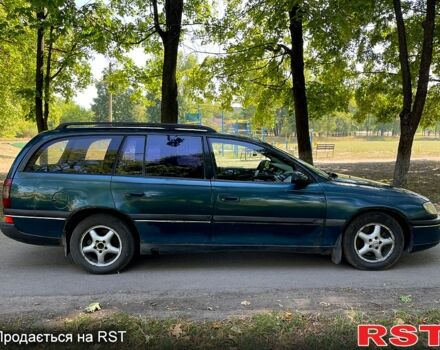 Зеленый Опель Омега, объемом двигателя 2.5 л и пробегом 263 тыс. км за 1400 $, фото 2 на Automoto.ua