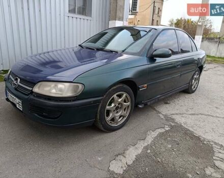 Зеленый Опель Омега, объемом двигателя 2 л и пробегом 321 тыс. км за 1100 $, фото 1 на Automoto.ua