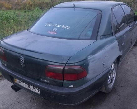 Зеленый Опель Омега, объемом двигателя 2 л и пробегом 390 тыс. км за 400 $, фото 1 на Automoto.ua