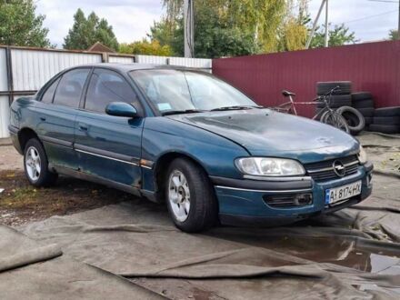 Зеленый Опель Омега, объемом двигателя 2 л и пробегом 180 тыс. км за 650 $, фото 1 на Automoto.ua