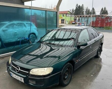 Зеленый Опель Омега, объемом двигателя 2 л и пробегом 300 тыс. км за 1250 $, фото 1 на Automoto.ua