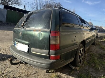 Зеленый Опель Омега, объемом двигателя 2 л и пробегом 300 тыс. км за 370 $, фото 1 на Automoto.ua