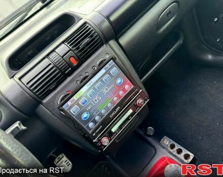 Черный Опель Тигра, объемом двигателя 1.4 л и пробегом 220 тыс. км за 2600 $, фото 11 на Automoto.ua
