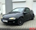 Черный Опель Тигра, объемом двигателя 1.4 л и пробегом 220 тыс. км за 2600 $, фото 2 на Automoto.ua