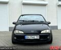 Черный Опель Тигра, объемом двигателя 1.4 л и пробегом 220 тыс. км за 2600 $, фото 5 на Automoto.ua