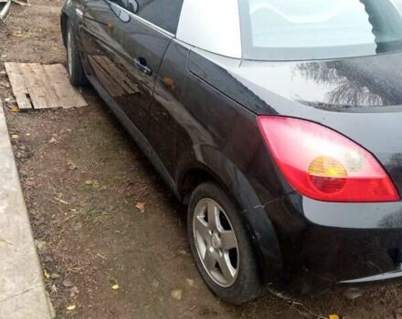 Черный Опель Тигра, объемом двигателя 1.4 л и пробегом 164 тыс. км за 5000 $, фото 2 на Automoto.ua