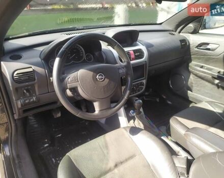 Черный Опель Тигра, объемом двигателя 1.8 л и пробегом 200 тыс. км за 5200 $, фото 5 на Automoto.ua