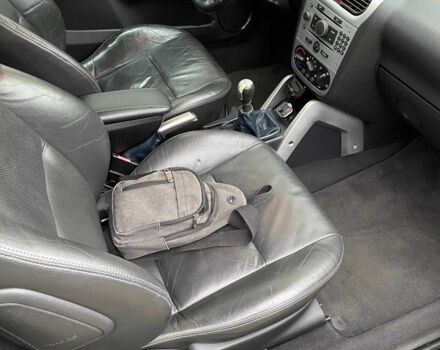 Черный Опель Тигра, объемом двигателя 1.8 л и пробегом 167 тыс. км за 5000 $, фото 17 на Automoto.ua