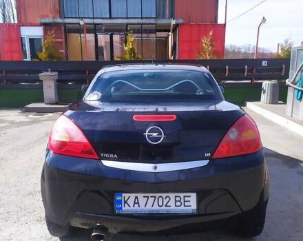 Черный Опель Тигра, объемом двигателя 1.8 л и пробегом 200 тыс. км за 5200 $, фото 3 на Automoto.ua