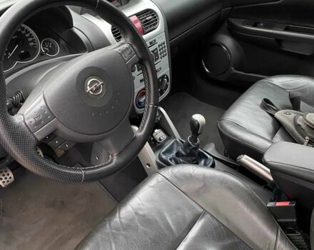 Черный Опель Тигра, объемом двигателя 1.8 л и пробегом 167 тыс. км за 5000 $, фото 15 на Automoto.ua