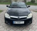 Черный Опель Тигра, объемом двигателя 1.36 л и пробегом 310 тыс. км за 4000 $, фото 1 на Automoto.ua