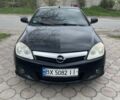 Черный Опель Тигра, объемом двигателя 1.36 л и пробегом 310 тыс. км за 4000 $, фото 1 на Automoto.ua