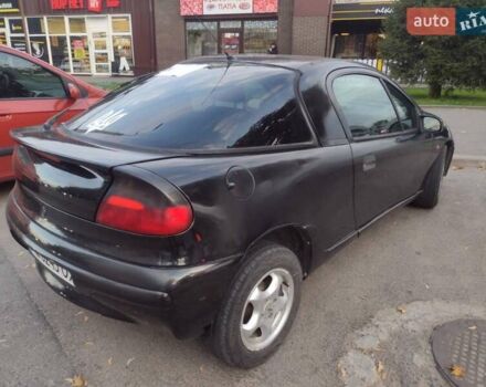 Чорний Опель Тігра, об'ємом двигуна 1.4 л та пробігом 260 тис. км за 2000 $, фото 2 на Automoto.ua