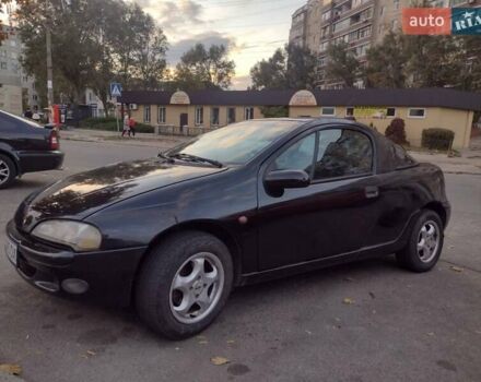 Чорний Опель Тігра, об'ємом двигуна 1.4 л та пробігом 260 тис. км за 2000 $, фото 7 на Automoto.ua