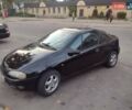 Чорний Опель Тігра, об'ємом двигуна 1.4 л та пробігом 260 тис. км за 2000 $, фото 1 на Automoto.ua