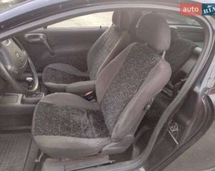 Чорний Опель Тігра, об'ємом двигуна 1.4 л та пробігом 260 тис. км за 2000 $, фото 15 на Automoto.ua