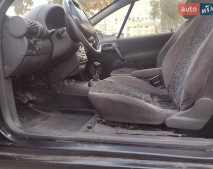 Чорний Опель Тігра, об'ємом двигуна 1.4 л та пробігом 260 тис. км за 2000 $, фото 13 на Automoto.ua