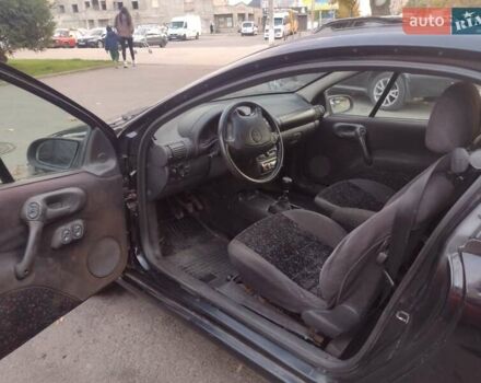 Чорний Опель Тігра, об'ємом двигуна 1.4 л та пробігом 260 тис. км за 2000 $, фото 14 на Automoto.ua