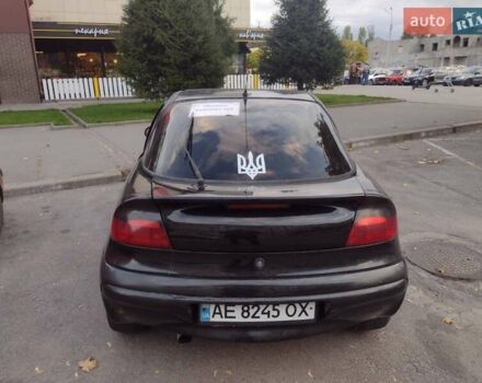 Чорний Опель Тігра, об'ємом двигуна 1.4 л та пробігом 260 тис. км за 2000 $, фото 10 на Automoto.ua