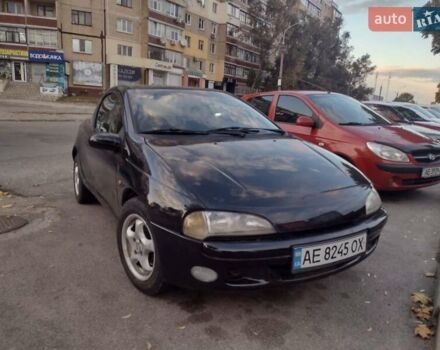 Чорний Опель Тігра, об'ємом двигуна 1.4 л та пробігом 260 тис. км за 2000 $, фото 1 на Automoto.ua