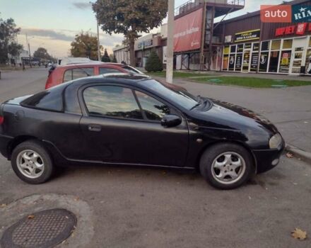 Чорний Опель Тігра, об'ємом двигуна 1.4 л та пробігом 260 тис. км за 2000 $, фото 5 на Automoto.ua