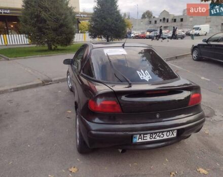 Чорний Опель Тігра, об'ємом двигуна 1.4 л та пробігом 260 тис. км за 2000 $, фото 12 на Automoto.ua