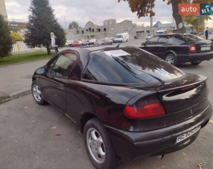 Чорний Опель Тігра, об'ємом двигуна 1.4 л та пробігом 260 тис. км за 2000 $, фото 3 на Automoto.ua