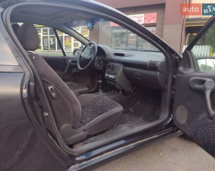 Чорний Опель Тігра, об'ємом двигуна 1.4 л та пробігом 260 тис. км за 2000 $, фото 17 на Automoto.ua