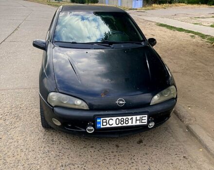 Черный Опель Тигра, объемом двигателя 1.4 л и пробегом 200 тыс. км за 1750 $, фото 1 на Automoto.ua