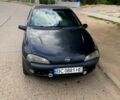 Черный Опель Тигра, объемом двигателя 1.4 л и пробегом 200 тыс. км за 1750 $, фото 1 на Automoto.ua