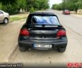 Черный Опель Тигра, объемом двигателя 1.4 л и пробегом 200 тыс. км за 1750 $, фото 2 на Automoto.ua