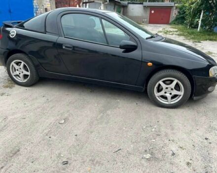 Чорний Опель Тігра, об'ємом двигуна 0 л та пробігом 240 тис. км за 2019 $, фото 1 на Automoto.ua